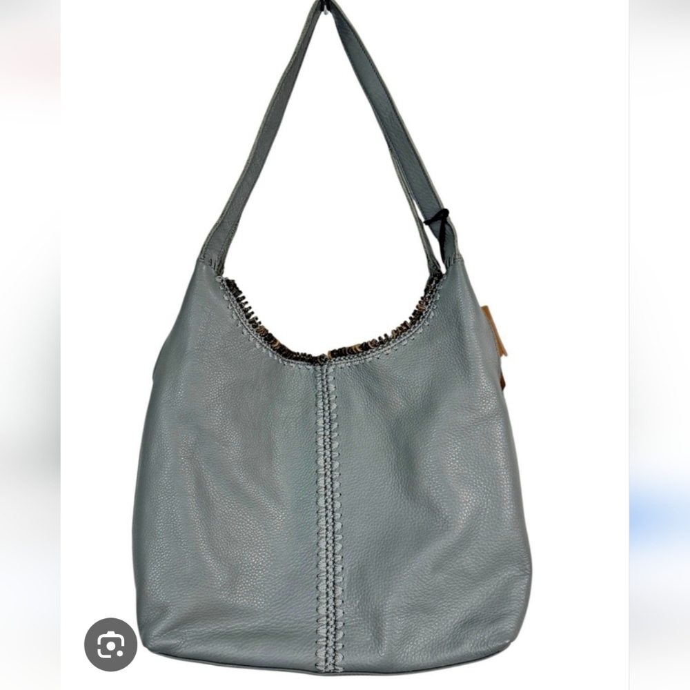 The Sak Huntley Hobo Bag, specifically in a gray pebbled leather.